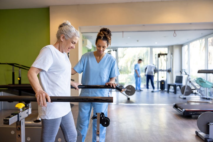 woman and nurse physical therapy