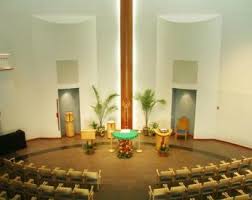 Photograph of chapel facing the alter and podium.