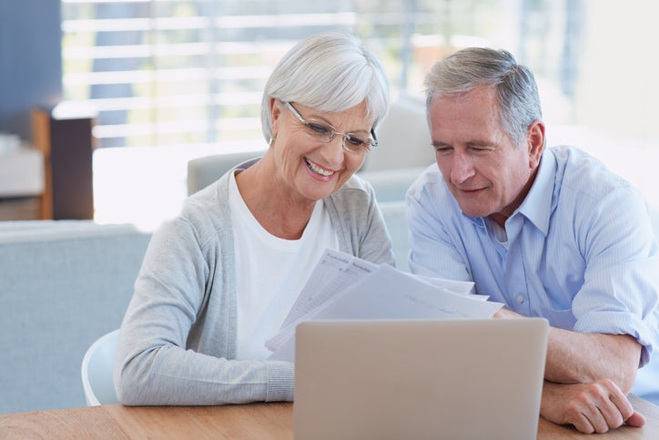 Elder coule looking at laptop