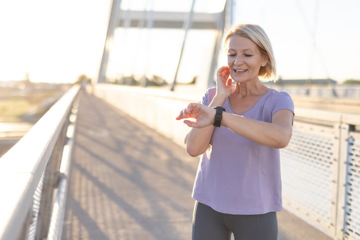 woman looking at watch