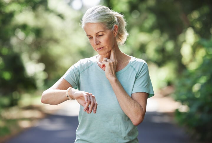 woman looking at watch