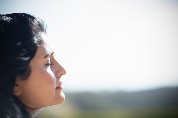 woman looking out of a window 