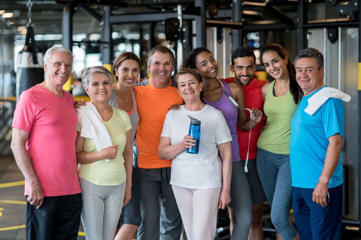 Happy group of people at the gym
